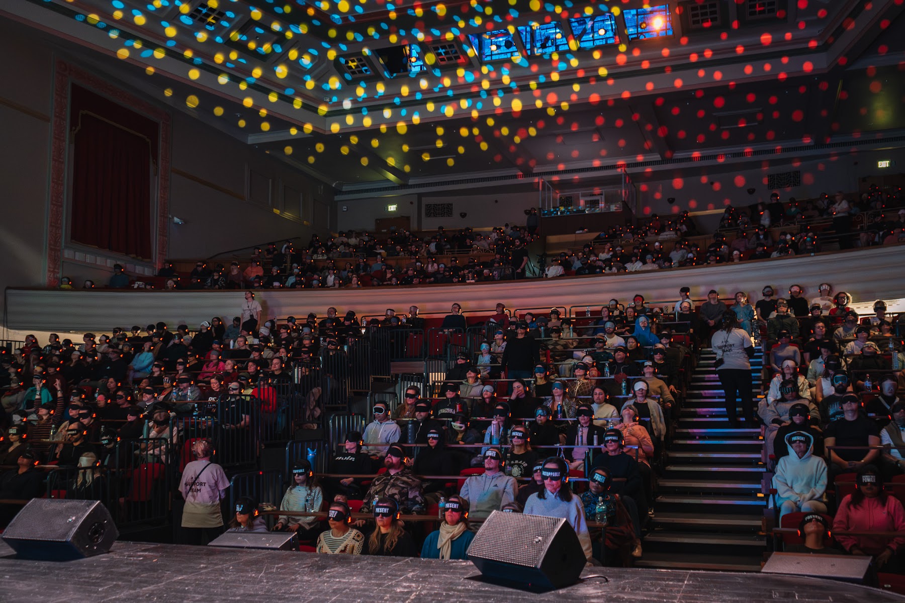 A full theatre audience during a Holosomatic® Experience